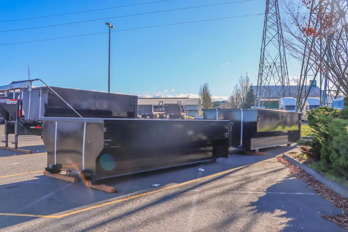 Roll-off dumpster ready for waste disposal at job site for 12 Yard Dumpster Rental in Lowell